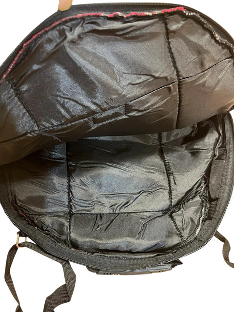 Inside view of Slick Cotton Ikat Carry Case For Twenty Four Inch Shaman Drum In Bold Red with padded black lining.