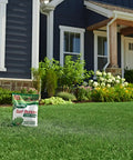 All Grass Types Lawn Fertilizer Twin Pack For 5000 Sq Ft Coverage 12.5 Lb in front of a house with green lawn