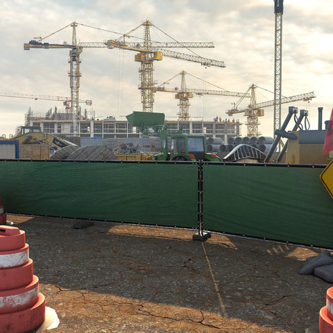 Construction site with 6 ft by 50 ft green fence privacy screen windscreen cover fabric shade netting mesh cloth installed