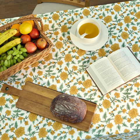 Top Tier Floral Block Print Cotton Tablecloth Yellow Rectangular Dining Cover Washable Farmhouse Kitchen Linen with fruit and bread display.