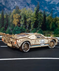 Endurance Racer 3D Wooden Puzzle Kit for Adults, DIY Mechanical Car Model With Realistic Transmission, Pistons, Suspension, and Radiator Fan, Wood Sports Car Brain Teaser and Epic Hobby Gift on a road display