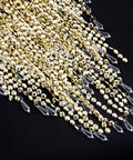 Close-up of gold frame and crystal beads detailing on Acrylic Chandelier Shade With Crystal Beads And Gold Frame Dope Three-Tier Beaded Pendant Lampshade, 12.6 Inch Diameter, Ideal For Bedroom Weddings Or Parties, Easy Fit For Most Sockets And Bulbs, No Bulbs Included.
