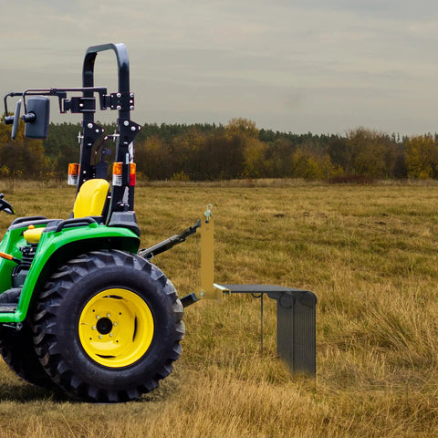 72 Inch Tow Behind Landscape Rake with 32 Steel Tine Dethatcher for Category 1 Tractors in use on grassy field