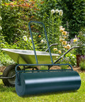 24 Inch Lawn Roller With 13 Gallon Capacity Heavy Duty Steel Yard Roller in garden beside wheelbarrow