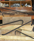 36 Inch Pry Bar With Drop Forged Steel Build, Rust Resistant Crowbar For Demolition displayed among wooden planks
