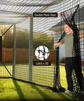 Person opening door of Heavy Duty Baseball Batting Cage Net With Door For Backyard And Indoor Practice 8 By 8 By 20 Feet Enclosed Hitting Netting Weather Resistant Polyester No Frame Included Ideal For Baseball And Softball Training in a backyard setting.