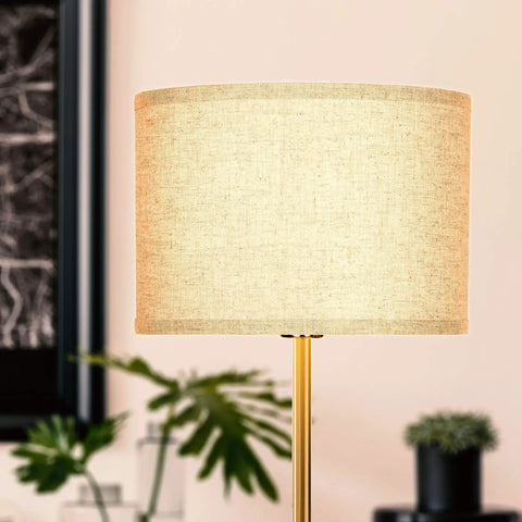 Emery LED Floor Lamp With Drum Shade, Tall Mid Century Standing Light For Bedroom Reading, brass finish close-up with plants