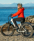 Woman on e-bike with 2-Pack 20 Inch Fat Bike Inner Tubes For 20x4.5 Or 20x5.0 Tires, 32mm Schrader Valve, beach view