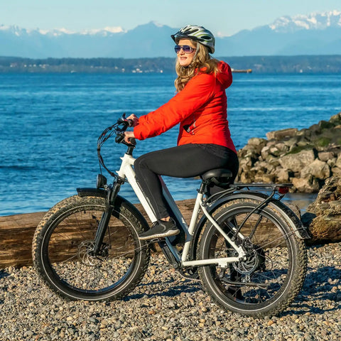 Woman on e-bike with 2-Pack 20 Inch Fat Bike Inner Tubes For 20x4.5 Or 20x5.0 Tires, 32mm Schrader Valve, beach view
