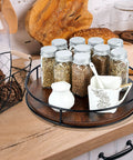 12 Inch Lazy Susan Slick Counter Turntable Kitchen Spice Rack Rustic Brown Wood Swivel Tray with spice jars and cream pitcher