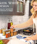 Built Tough 3 Tier Expandable Spice Rack Featuring Adjustable Length And Secure Non Slip Shelves Ultimate Game Changer For Kitchen Cabinet Pantry Or Countertop 2 Pack White And Grey with spice jars on countertop.