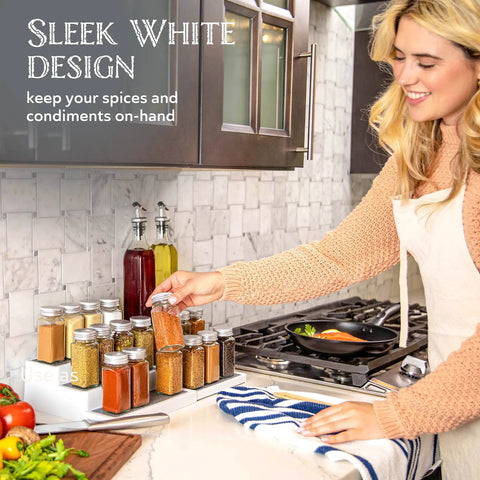 Built Tough 3 Tier Expandable Spice Rack Featuring Adjustable Length And Secure Non Slip Shelves Ultimate Game Changer For Kitchen Cabinet Pantry Or Countertop 2 Pack White And Grey with spice jars on countertop.