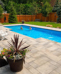 Backyard pool with stone patio showcasing Top Notch Paver Underlayment Fabric 8 Oz For All Paver Types Made In America 50 Year