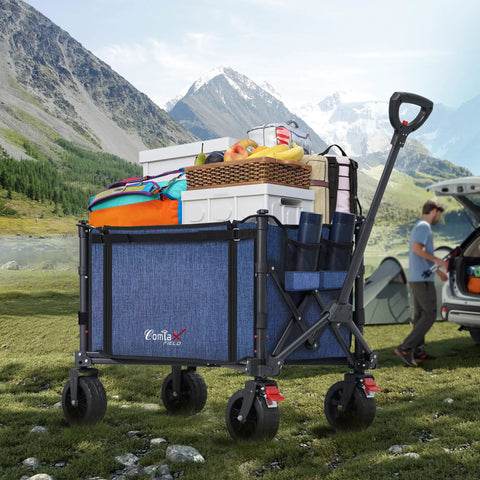 Collapsible Wagon Cart With Big Wheels And Brakes 250 Pound Capacity Lightweight Foldable Utility Wagon blue filled with camping gear on grass with mountains