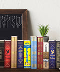 Blue Math Classroom Book Safe Featuring Authentic School Pages And Reliable Three Digit Combination Lock For Stealth Stash Storage And Slick Student Loot Vault on a bookshelf.