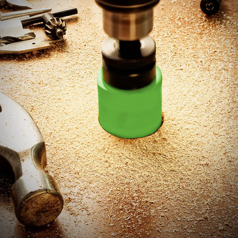 Close-up of a green hole saw cutting wood with 18 Piece Bi Metal Hole Saw Kit With Beefy Cutters And Carrying Case For Metal Wood Plastic