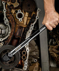 Mechanic using Half Inch Drive Click Torque Wrench Pro Grade With Ten To One Hundred Fifty Foot Pounds Range in an engine repair