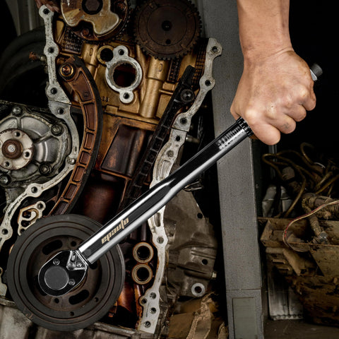 Mechanic using Half Inch Drive Click Torque Wrench Pro Grade With Ten To One Hundred Fifty Foot Pounds Range in an engine repair