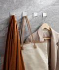 Self Adhesive Towel Hooks Four Pack Stick On Wall Stainless Steel 304 holding robe, bag, and towel, no drill, heavy duty adhesive.