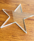 Super Slick Clear Acrylic Coaster Templates For Woodworking Router Guides Dead Simple Laser Cut Craft Jigs in star shape on wood surface.