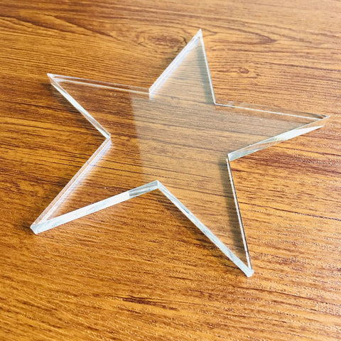 Super Slick Clear Acrylic Coaster Templates For Woodworking Router Guides Dead Simple Laser Cut Craft Jigs in star shape on wood surface.