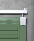 Heavy Duty 10 Foot Galvanized Outdoor Sliding Barn Door Hardware Kit With 450 Lb Capacity Exterior Track System Installed on Green Door