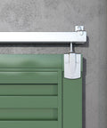 12 Foot Heavy Duty Galvanized Steel Exterior Sliding Barn Door Hardware Kit For Outdoor Use With 450 Lb Capacity And Black Powder Coated Anti Corrosion Finish Designed To Fit A Single Door Up To 72 Inches Wide installed close-up view on green door