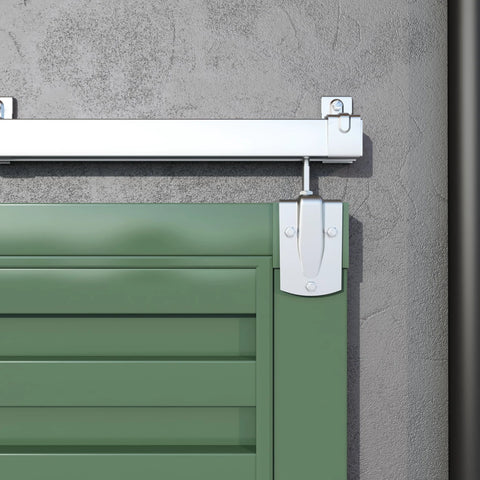 12 Foot Heavy Duty Galvanized Steel Exterior Sliding Barn Door Hardware Kit For Outdoor Use With 450 Lb Capacity And Black Powder Coated Anti Corrosion Finish Designed To Fit A Single Door Up To 72 Inches Wide installed close-up view on green door