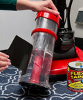Person using heavy duty rubberized waterproof tape for patching leaks and sealing repairs, black 4 in by 5 ft, next to vacuum.