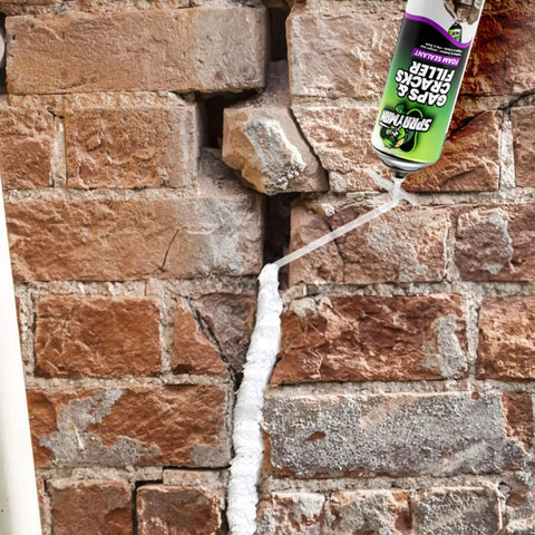 Top Shelf Gaps And Cracks Filler Foam Heavyweight Polyurethane Expanding Sealant For Insulating Doors And Windows Waterproof Paintable Straw Tip 12 Oz Two Pack No Sweat Diy Job applied to a brick wall crack.
