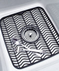Small Sink Protector Mat With Black Wave Design For Kitchen Sinks, Thick And Flexible, Non Slip, Center Drain Cutout, In Use