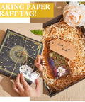 Gift box with decorated tags made using the 3 In 1 Craft Tag Punch Kit, featuring round punches and rope for paper crafting and scrapbooking.