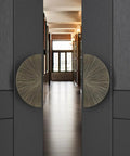 Close-up of Ultra Tough As Nails Heavy Duty Sliding Barn Door Handle Set with glass pulls on modern doors in a hallway.