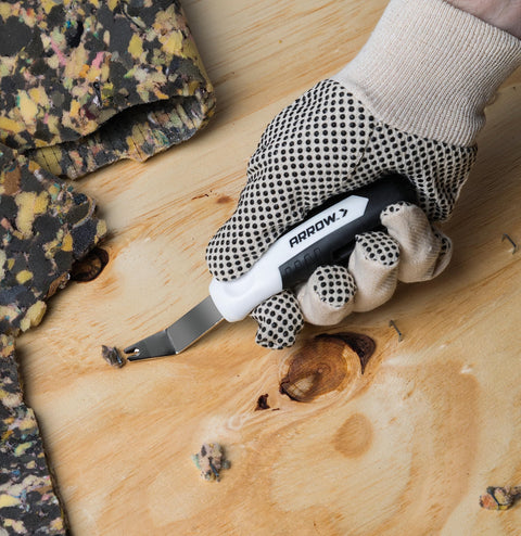Heavy Duty Staple Remover Tool Featuring A Sturdy Stainless Steel Lifter For Upholstery Furniture Fixes And Crafts Dead Simple No Sweat Pulling Power in use on wood.