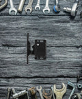 RV Cabinet Door Latches With Screws, Pull-To-Open Camper Cabinet Latch on wooden background with tools, compact design black ABS plastic