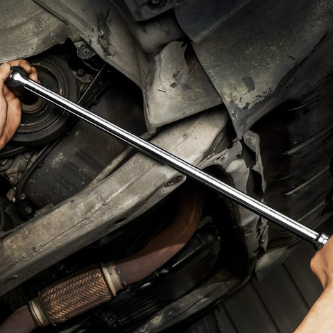 Mechanic using 24 Inch Half Inch Drive Breaker Bar With 180 Degree Flex Head In Hardened Cr-V Steel Beefy Heavy Duty Chrome Plated Finish For Rust Resistant Lug Nut Breaks And Easy Torque At Any Angle under a car.