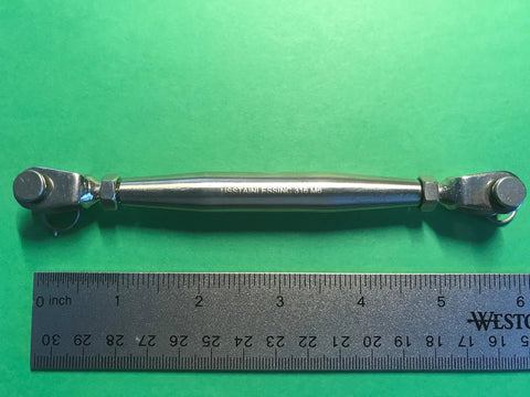 Top Shelf Marine Grade 316 Stainless Steel Turnbuckle Rigging Screw With Jaw To Jaw Ends M6 Quarter Inch, shown with a ruler for size.