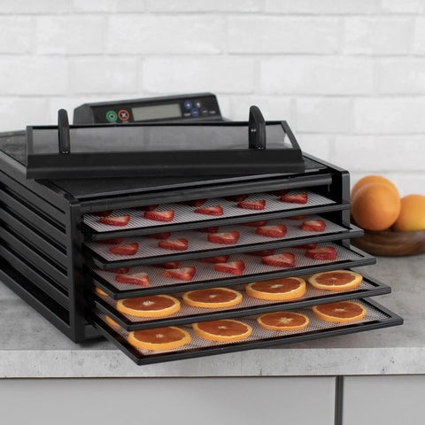 No Sweat Premium Electric Food Dehydrator With Clear Viewing Door And Five Stackable Trays features sliced strawberries and oranges.