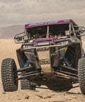 Heavy Duty Front Rack And Pinion Steering Drop In Swap For Polaris RZR 170 2009 To 2020 being tested on rugged terrain.