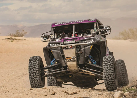 Heavy Duty Front Rack And Pinion Steering Drop In Swap For Polaris RZR 170 2009 To 2020 being tested on rugged terrain.