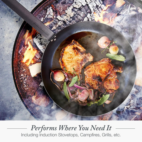 Budget-Friendly Carbon Steel Frying Pan 12 Inch pre-seasoned with pork chops and herbs over campfire flames