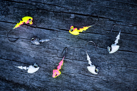 Crappie Jig Heads Multi Pack With Realistic Head Design And Sharp Hooks For Solid Hookups In One Eighth Ounce Size With Size Two Hooks With Multiple Colors Perfect For Crappie Fishing With Natural Swim Action And Versatile Performance on wooden background