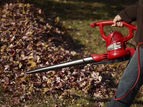 Person using Three In One Leaf Blower Vacuum With Metal Impeller And Infinite Variable Speed Up To Two Hundred Thirty Five MPH 12 Amp Power