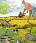 Woman using Heavy Duty Metal Leaf Rake With Adjustable 79 Inch Handle And 18 Inch Wide Head Featuring 25 Sturdy Tines for lawn cleanup.