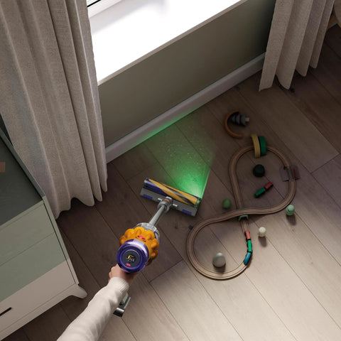 V12 Detect Slim Absolute Cordless Vacuum Cleaner with High Suction Power cleaning wooden floor with toys scattered around