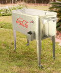 80 Quart Galvanized Rolling Cooler With Bottle Opener, Party Ready Ice Cold Retro Coca Cola Style Outdoor Beverage Cooler in garden