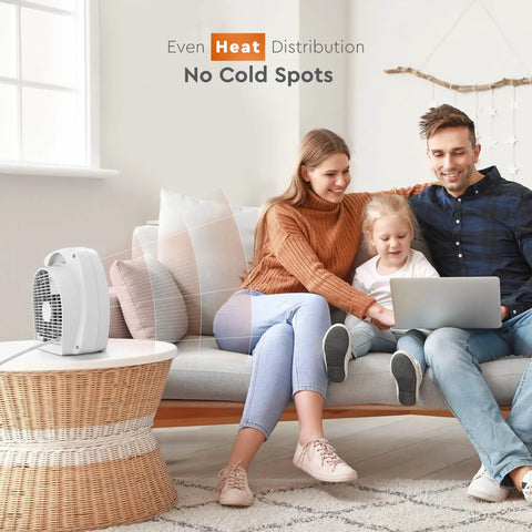 Family enjoying warmth from Dual Watt Personal Heater With 750 And 1500 Watts on a living room table
