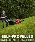 Man using Gas Self Propelled Lawn Mower With 21 Inch Cutting Width 3 In 1 Bagging Mulching Rear Discharge on grassy slope