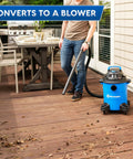 Person using 5 Gallon Wet And Dry Shop Vacuum With 3 Peak HP 65 CFM 16 Foot Reach Includes 8 Accessories With Cartridge Dry Filter And Foam Wet Filter VOC507PF Great For Home Or Shop Cleanup on a deck.