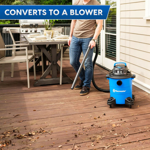 Person using 5 Gallon Wet And Dry Shop Vacuum With 3 Peak HP 65 CFM 16 Foot Reach Includes 8 Accessories With Cartridge Dry Filter And Foam Wet Filter VOC507PF Great For Home Or Shop Cleanup on a deck.